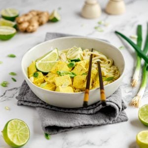 A bowl of vegan soto ayam with chopsticks.