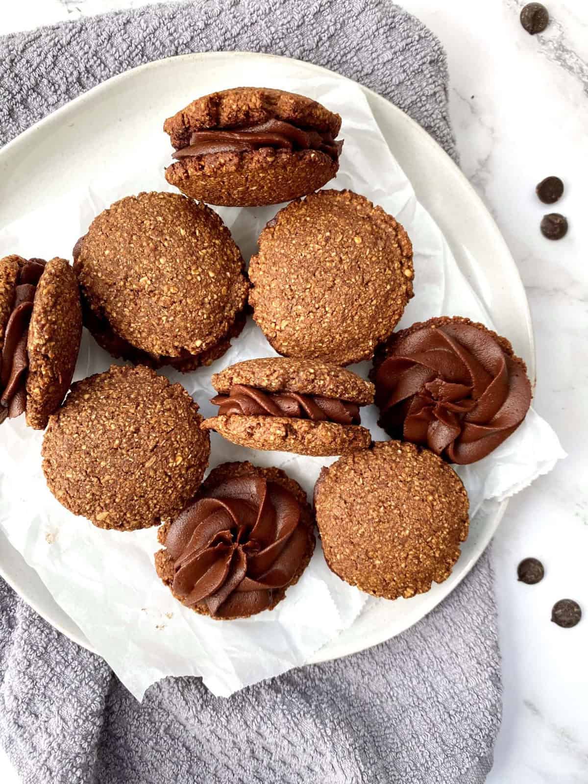 A plate of mocha sandwich cookies.