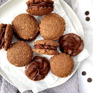 A plate of mocha sandwich cookies.