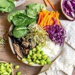 A mushroom rice poke bowl, loaded with veggies and toppings.