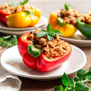 A plate with half of a no-bake vegan stuffed pepper.