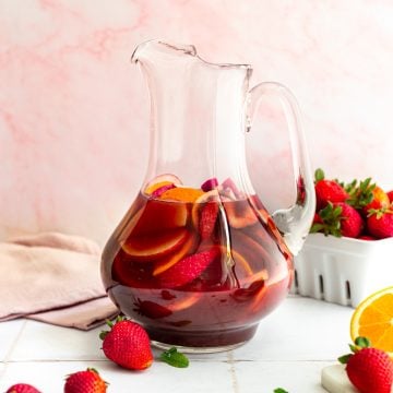 A pitcher of sangria mocktail with pomegranate juice.