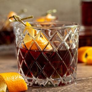 A mocktail garnished with orange peel.