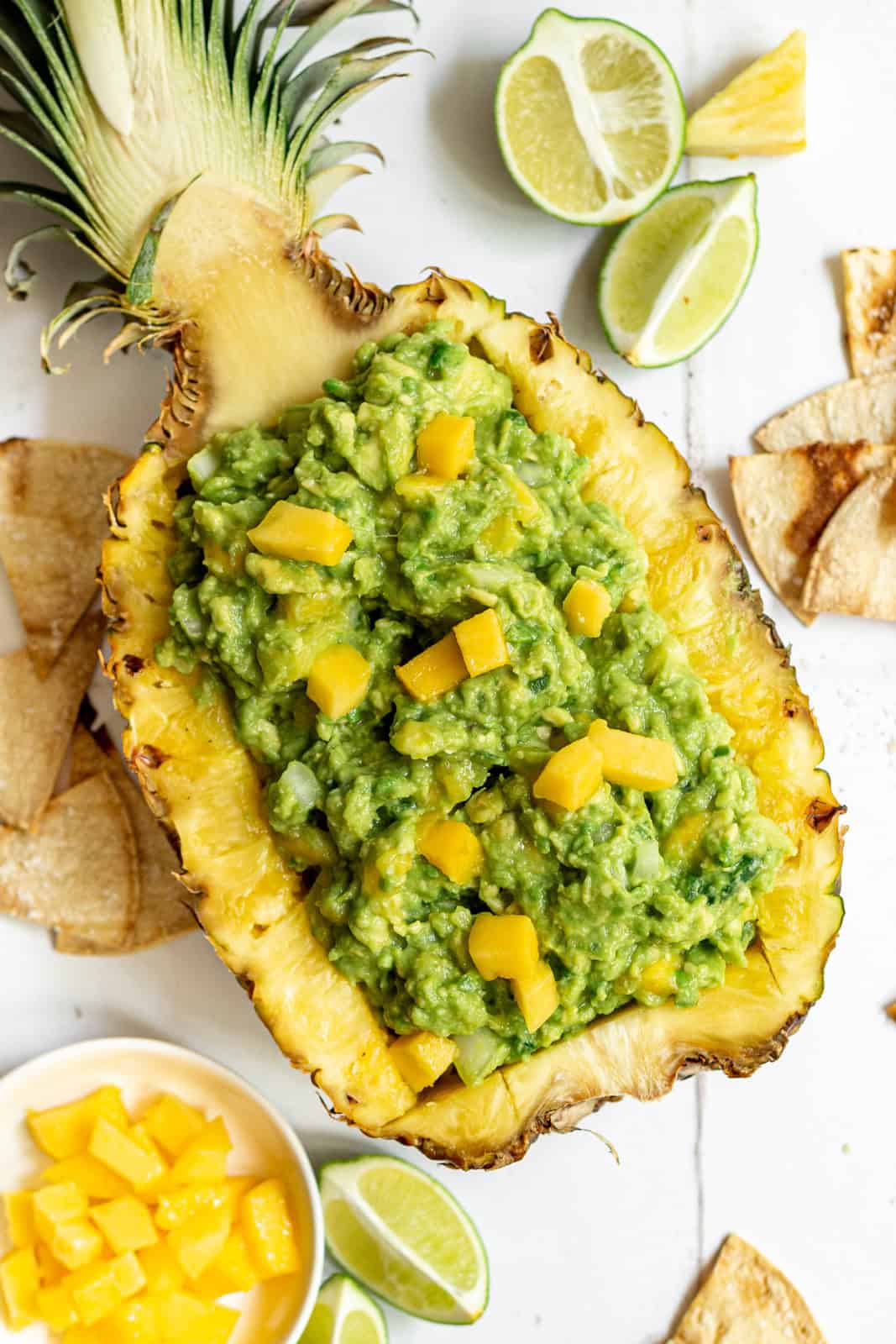 Pineapple mango guacamole served in a pineapple.