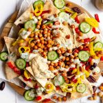 A tray of plant-based mediterranean nachos.