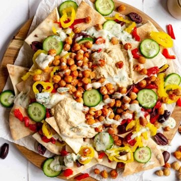 A tray of plant-based mediterranean nachos.