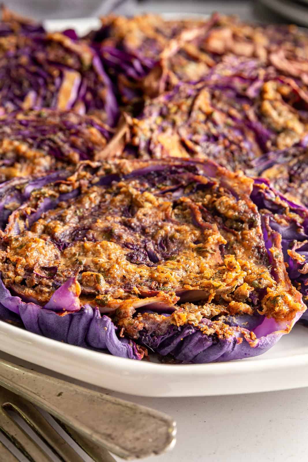 A tray of red cabbage steaks.