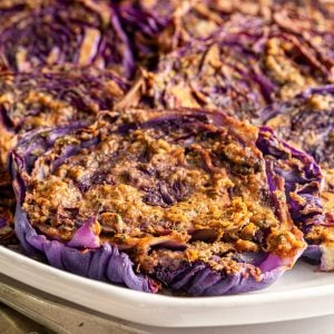 A tray of red cabbage steaks.