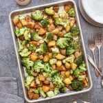 A tray of roasted broccoli and potatoes.