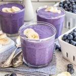 Three glasses of silken tofu smoothies, garnished with banana slices.