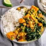A plate of sweet potato coconut curry served with rice.
