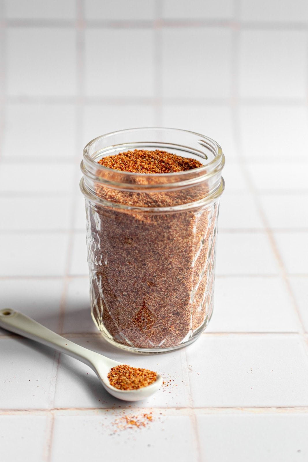 A mason jar filled with homemade taco seasoning.