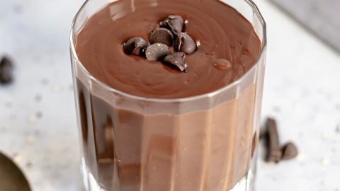 Vegan tahini hot chocolate topped with chocolate chips.