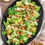 A large platter of tempeh caesar salad.