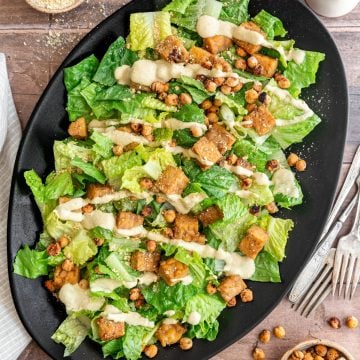 A large platter of tempeh caesar salad.