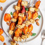 A plate of tofu apricot skewers, ready to serve.