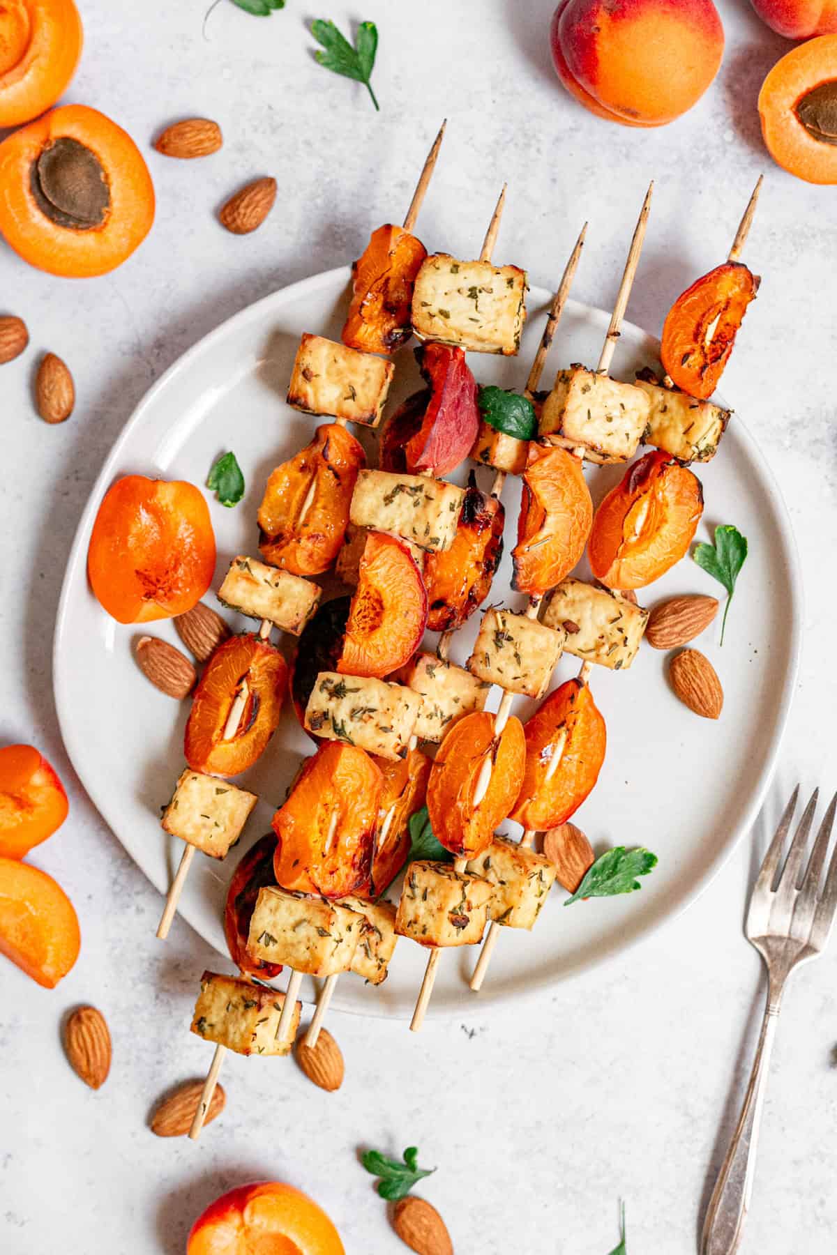 A plate of tofu apricot skewers, ready to serve.