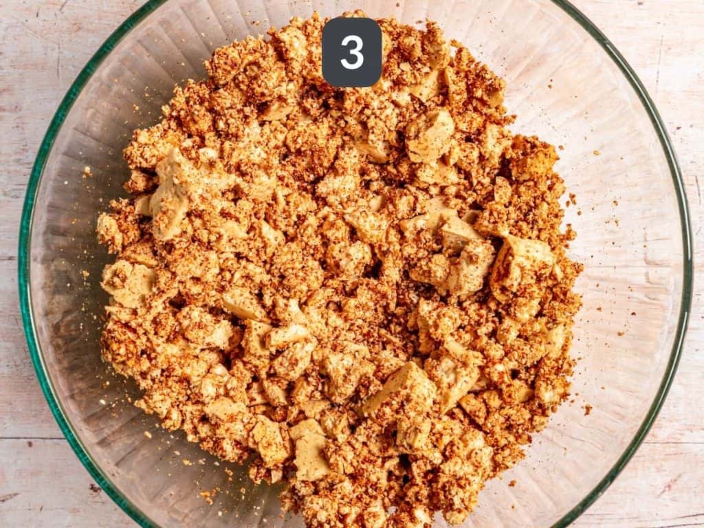 Tofu crumble and black bean tacos step 3 - toss the tofu with the taco seasoning.