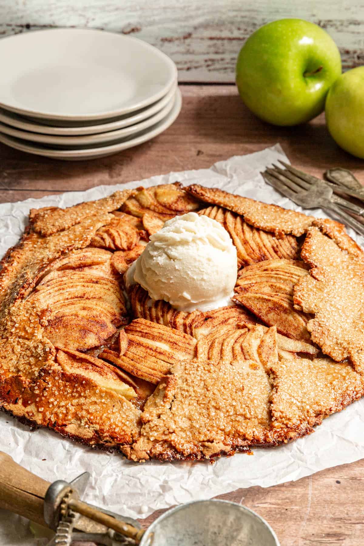 A Vegan Apple Galette topped with a scoop of ice cream, ready to serve.