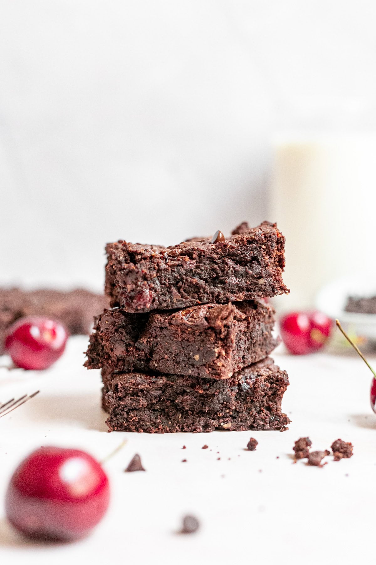 A stack of vegan black forest brownies.