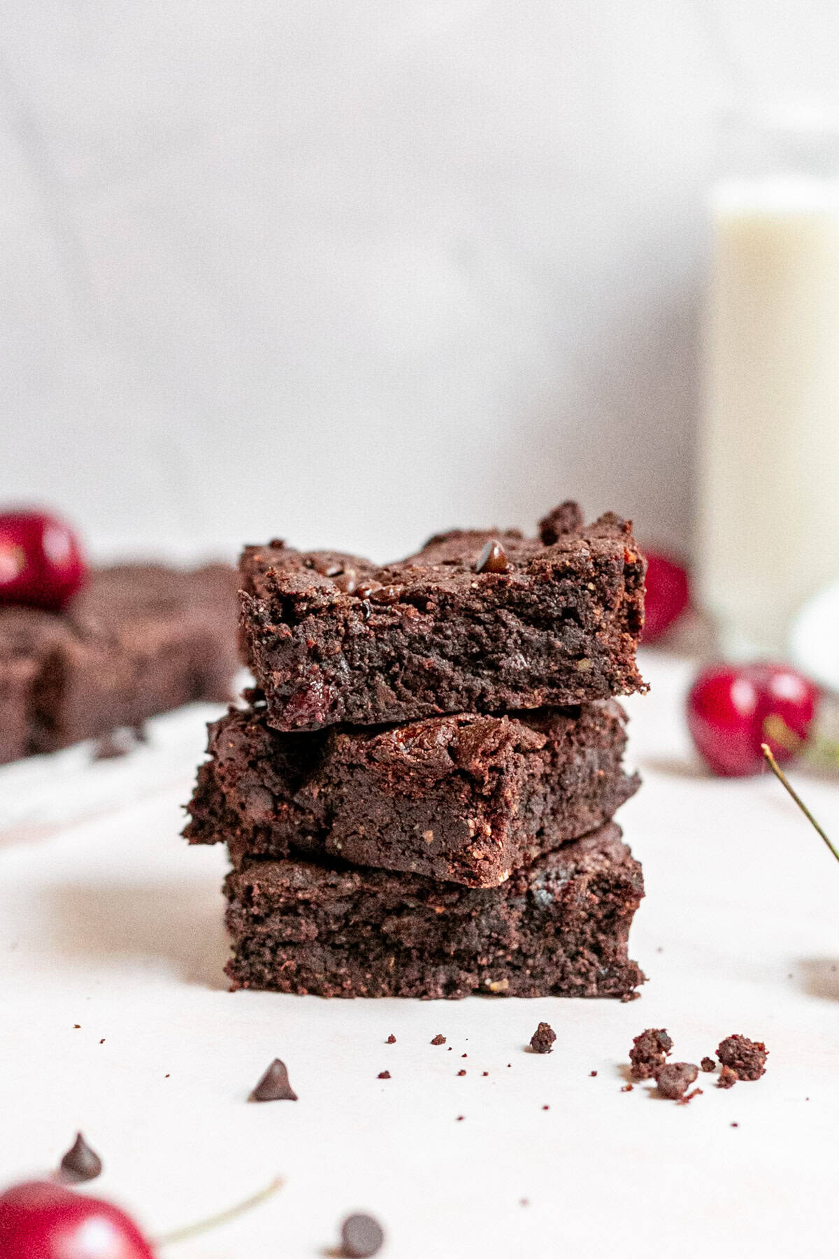A stack of vegan black forest brownies.