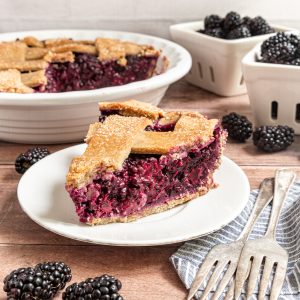 A slice of Vegan Blackberry Pie, ready to serve.