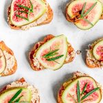Several vegan crostinis on a counter.