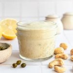 A jar of vegan oil-free cashew caesar dressing.