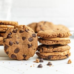 Two stacks of vegan peanut butter sandwich cookies.