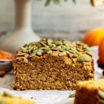 Vegan pumpkin banana bread with a slice removed.
