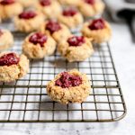 A cooling rack of vegan thumbprint cookies.