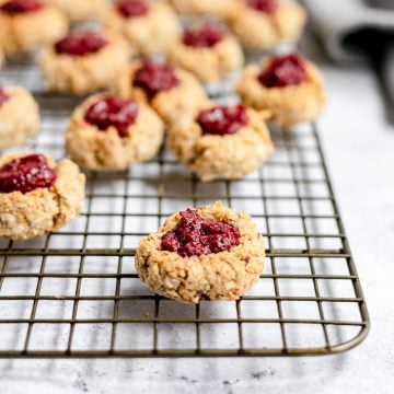A cooling rack of vegan thumbprint cookies.