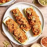 Three zucchini boats on a plate.