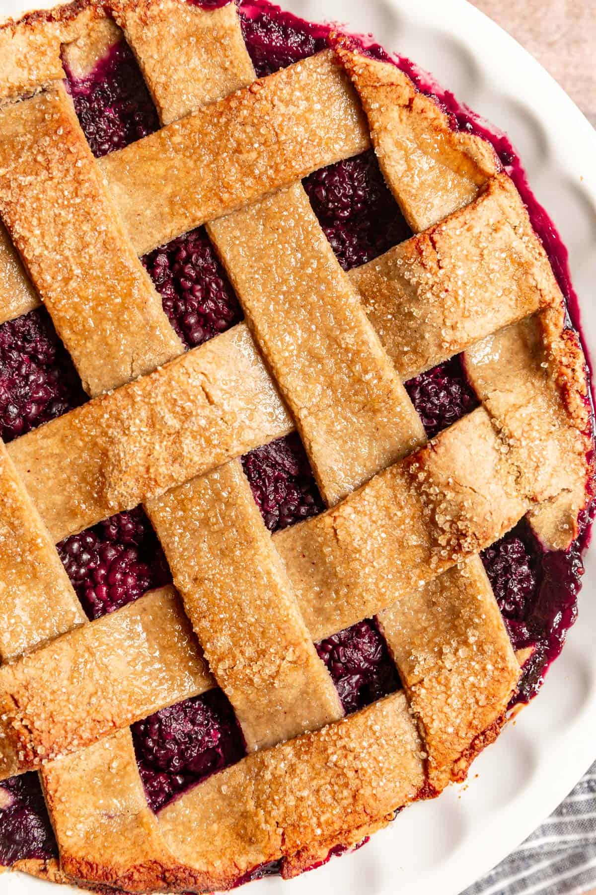 Baked blackberry pie, featuring a lattice crust.