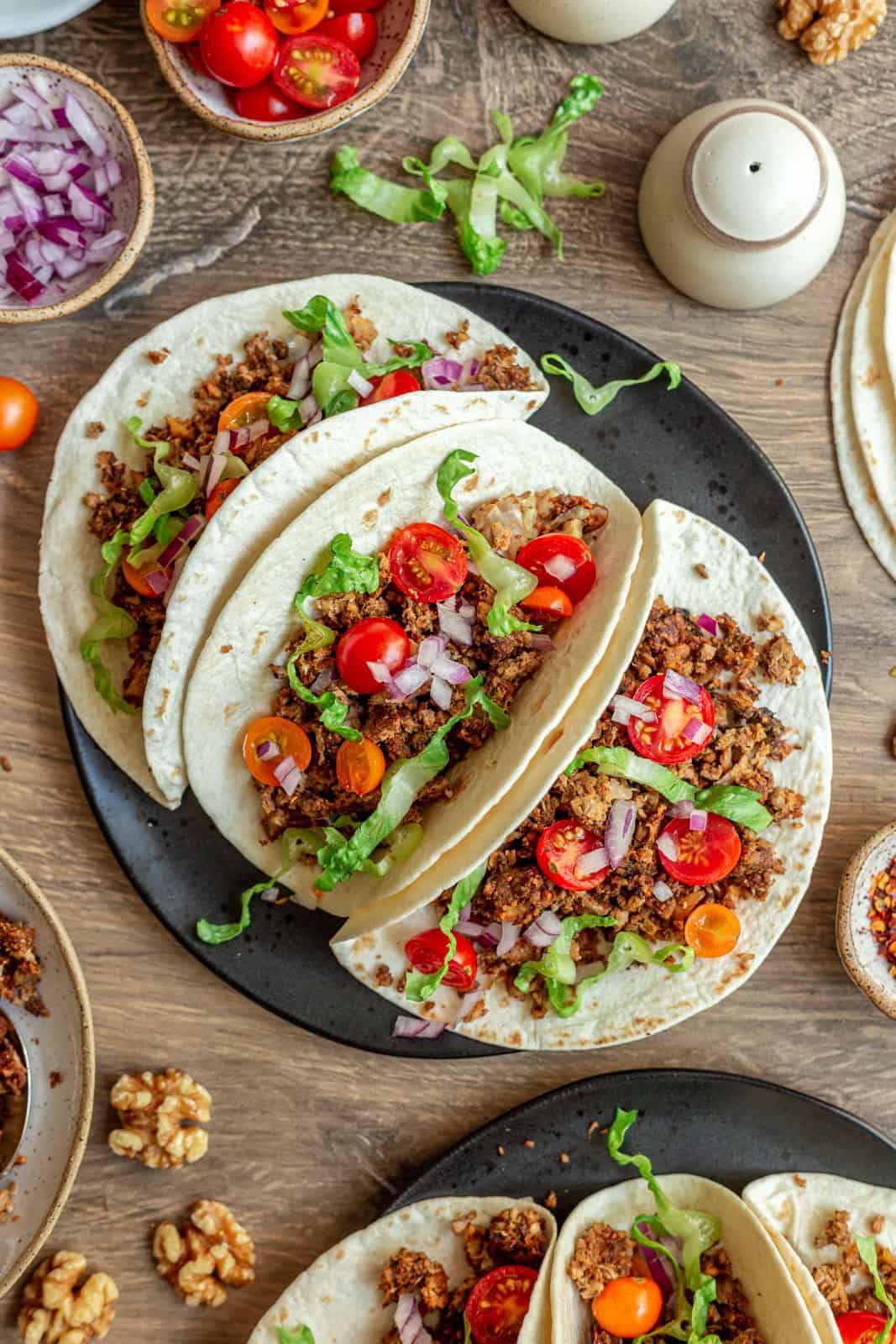 A plate of three mushroom walnut tacos.