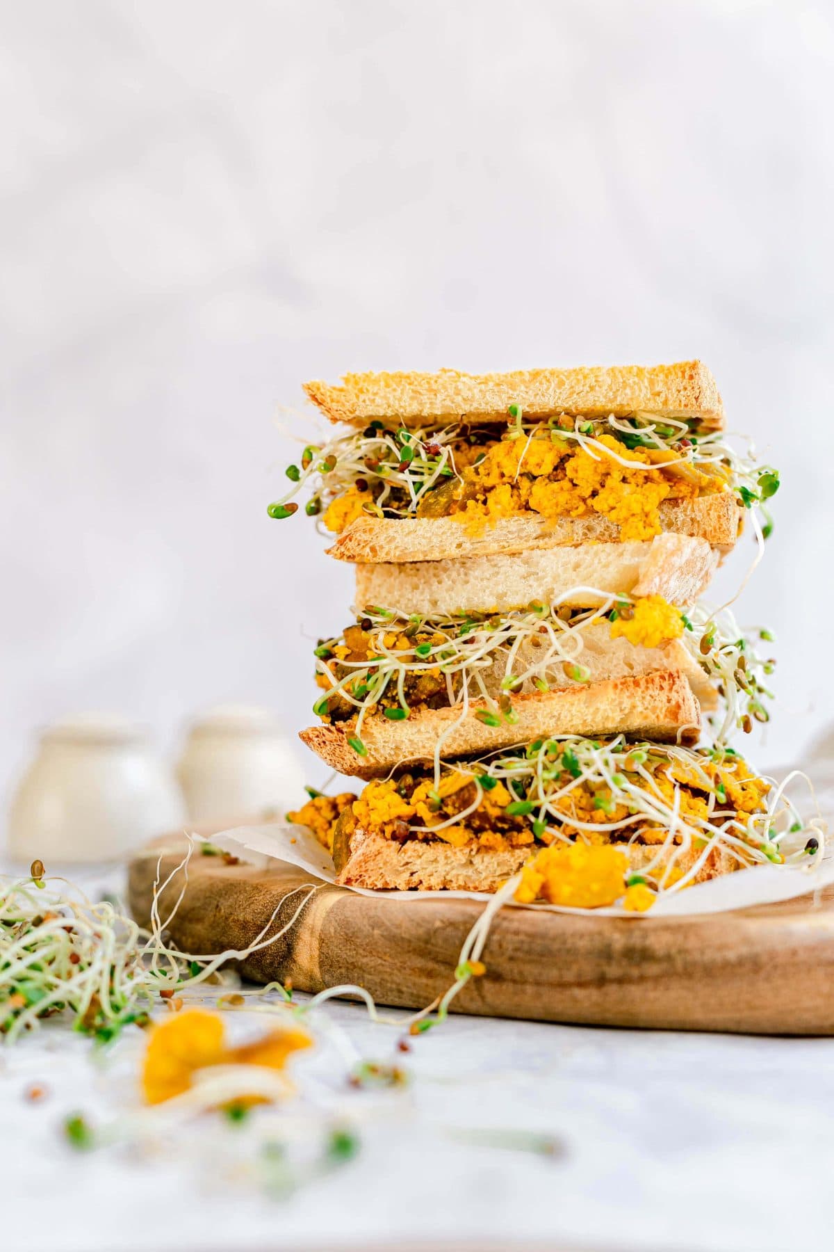 A stack of tofu scramble sandwiches, ready to serve.