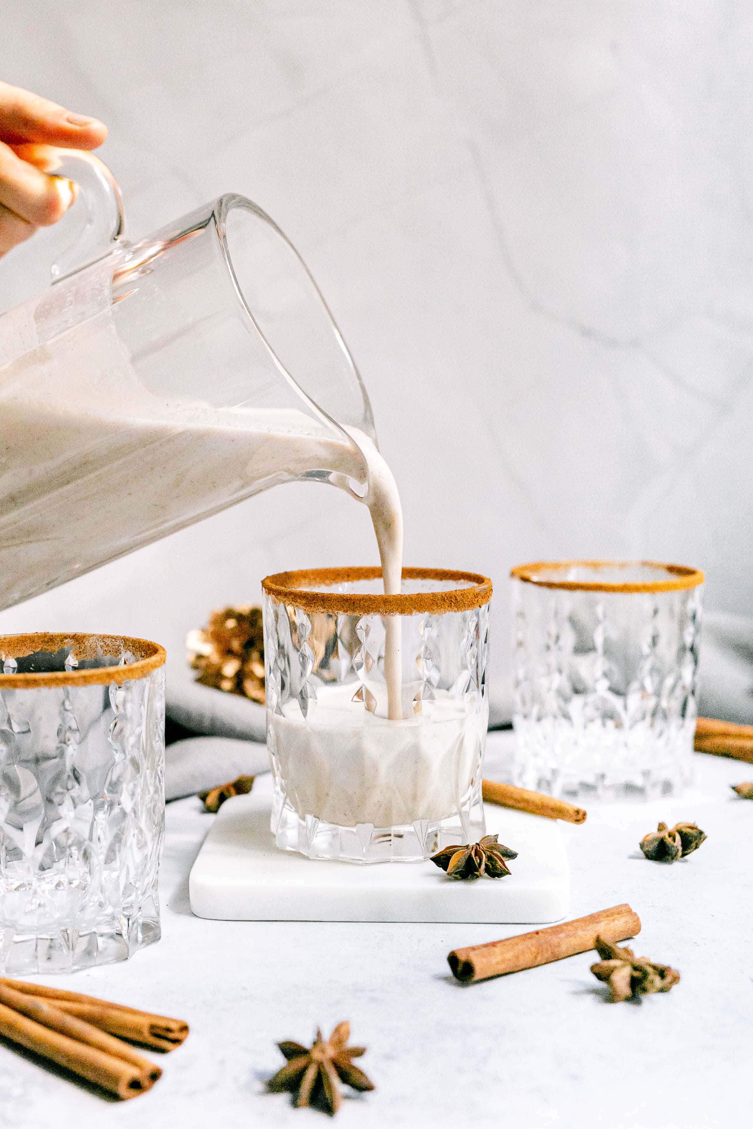 Plant-Based Eggnog poured into glass