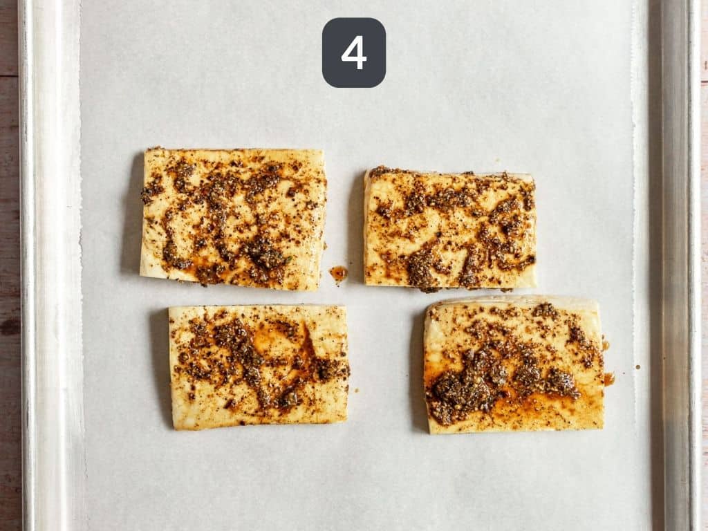 Lemon Pepper Tofu Step 4 - brush the tofu with sauce.