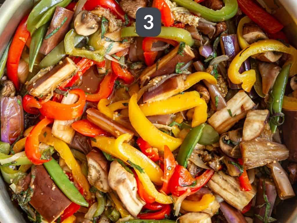 Thai Basil Eggplant Stir Fry Step 3 - add the sauce to the veggies.