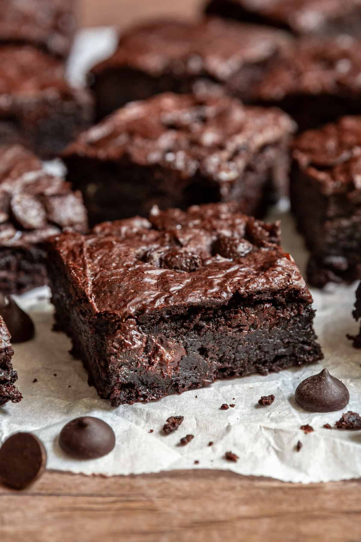 A side view of a vegan oil-free brownie, showing the fudgy texture.