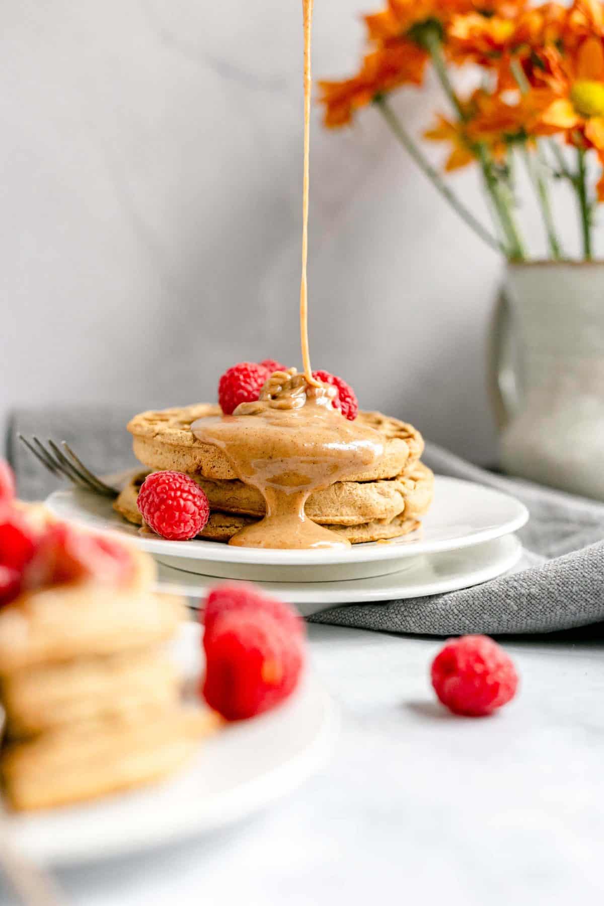 Plant-Based Honey Butter being poured onto waffles
