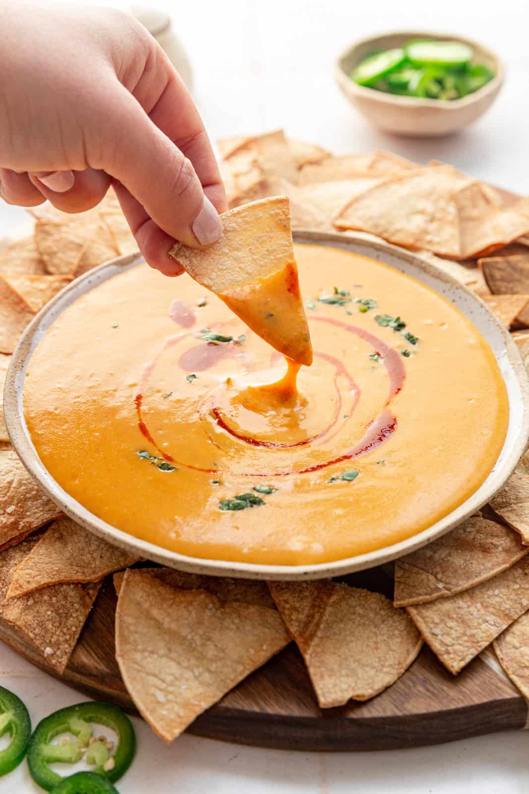 Chip dipped into Vegan Queso (No Cashews)