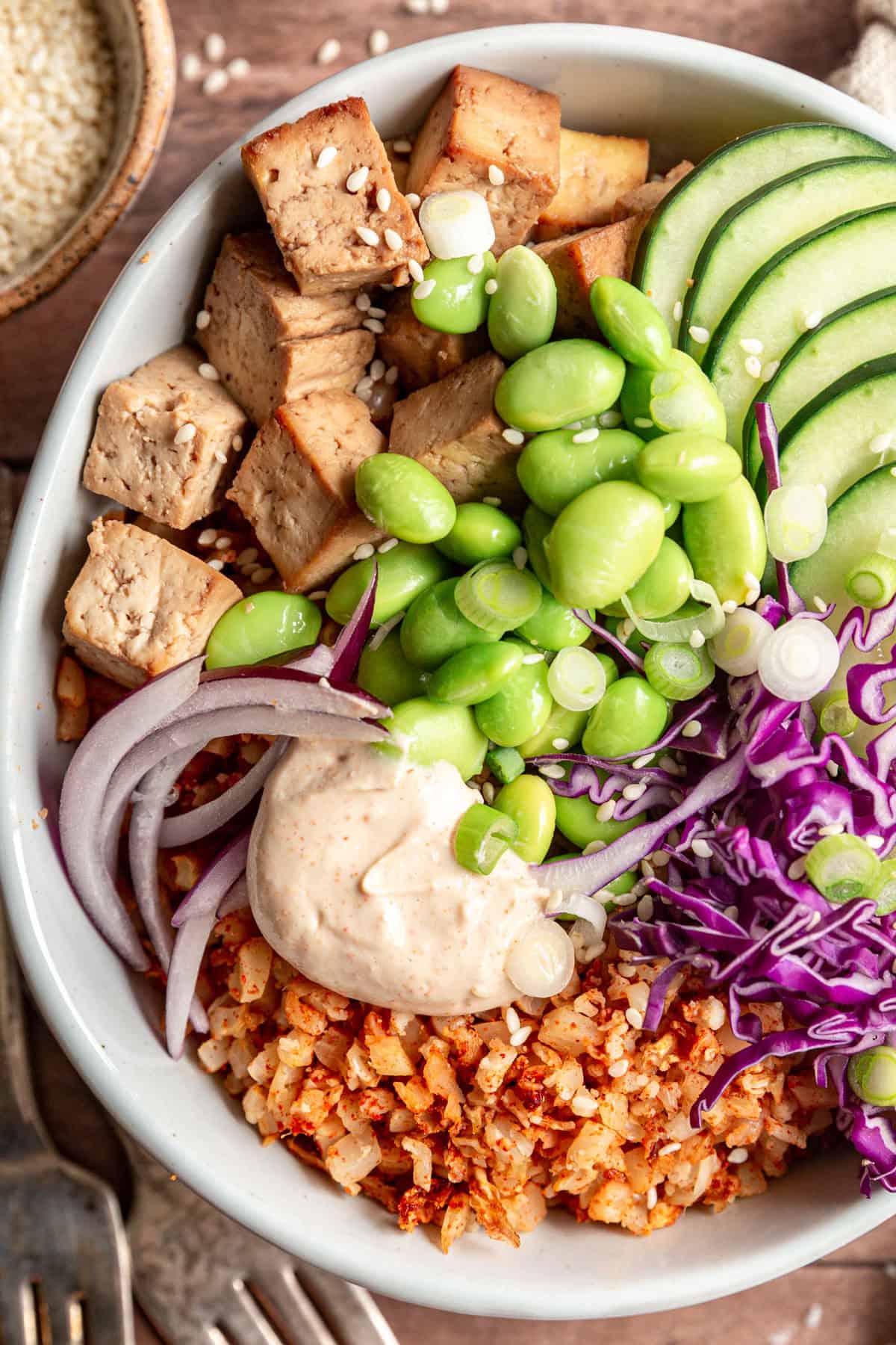 Air Fryer Cauliflower Rice Bowls garnished with sesame seeds.