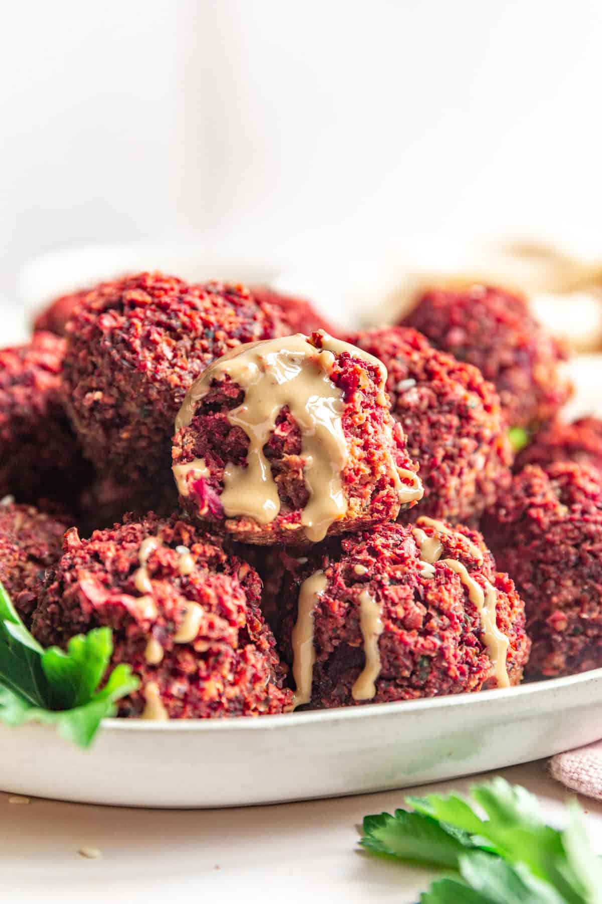 Baked Beetroot Falafel with a tahini drizzle.