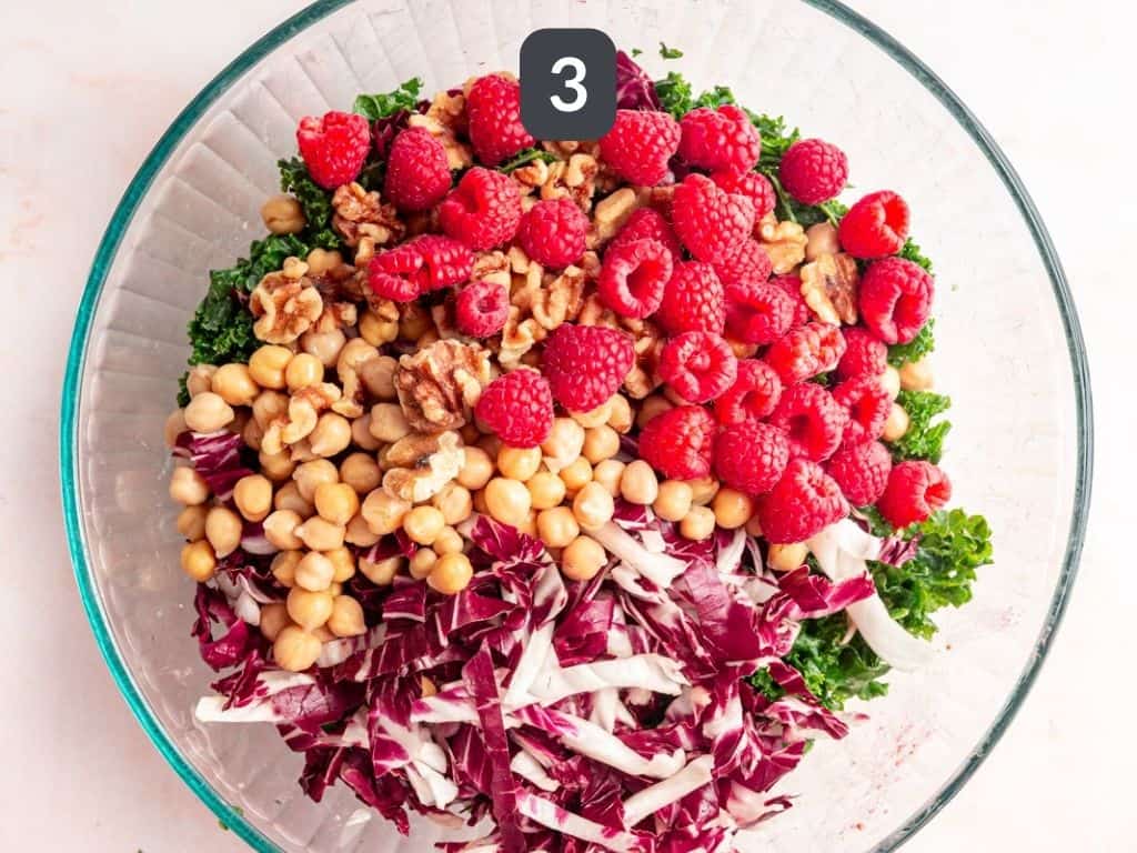 Raspberry Walnut Kale Salad step 3 - toss in remaining ingredients.
