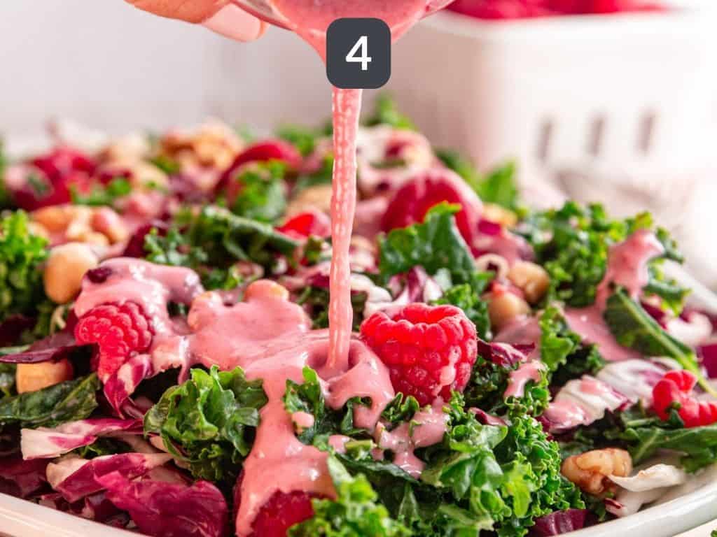 Raspberry Walnut Kale Salad step 4 - drizzle with dressing.