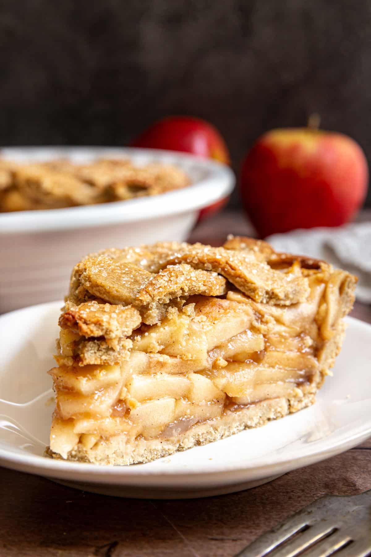 A slice of gluten free vegan apple pie on a plate.