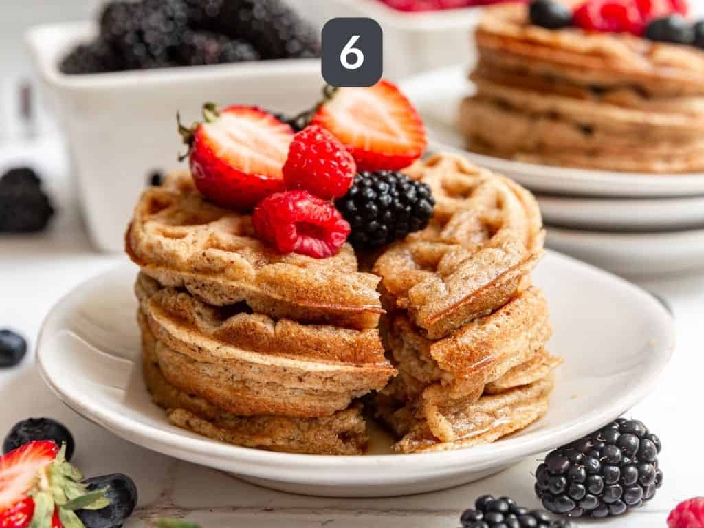 Oat flour waffles step 6 - serve with fresh berries and maple syrup.