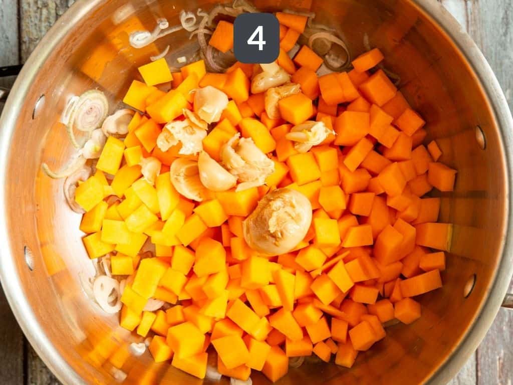 Roasted Garlic and Butternut Squash Risotto Step 4 - add the squash and garlic.
