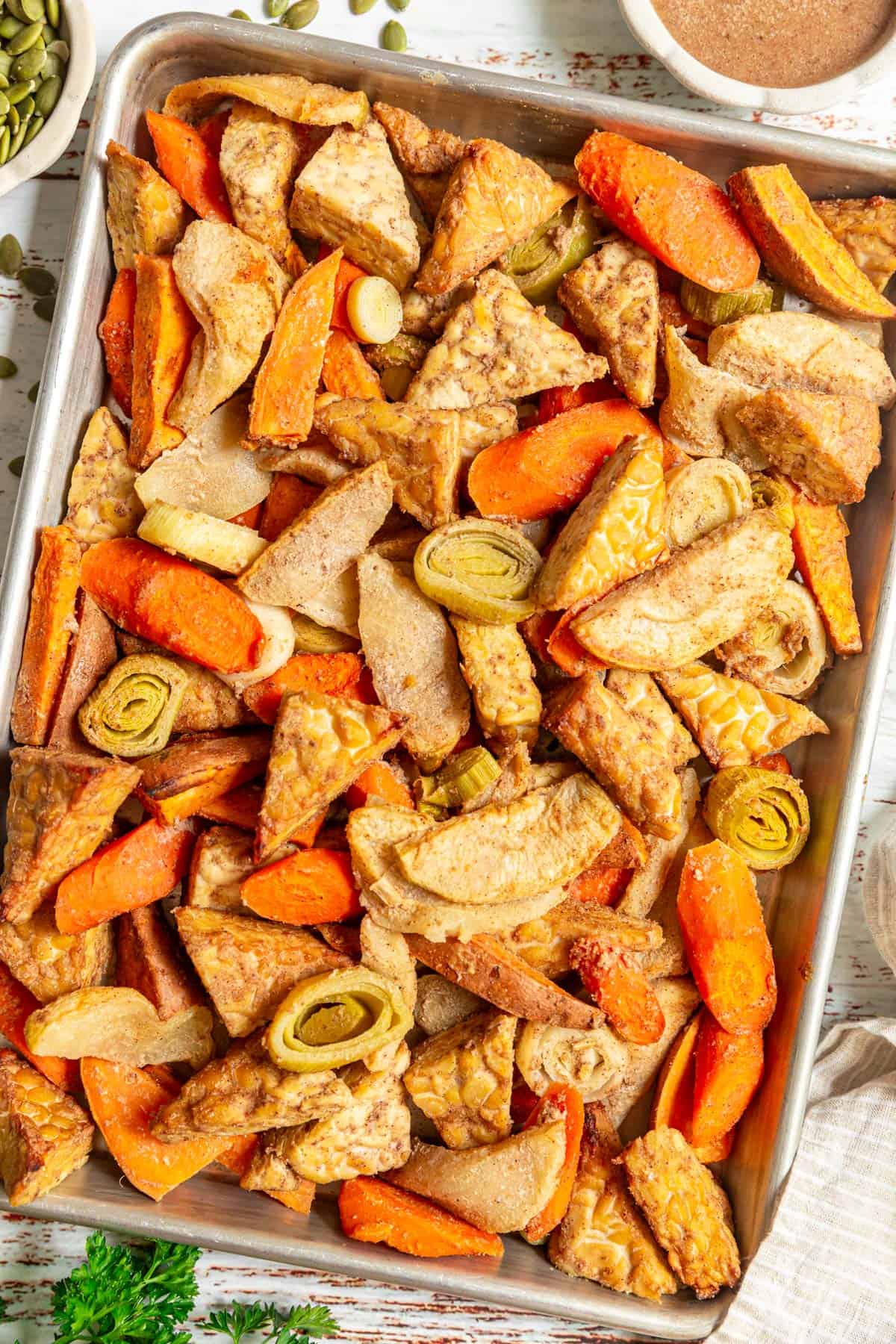A sheet pan full of roasted tempeh and vegetables.